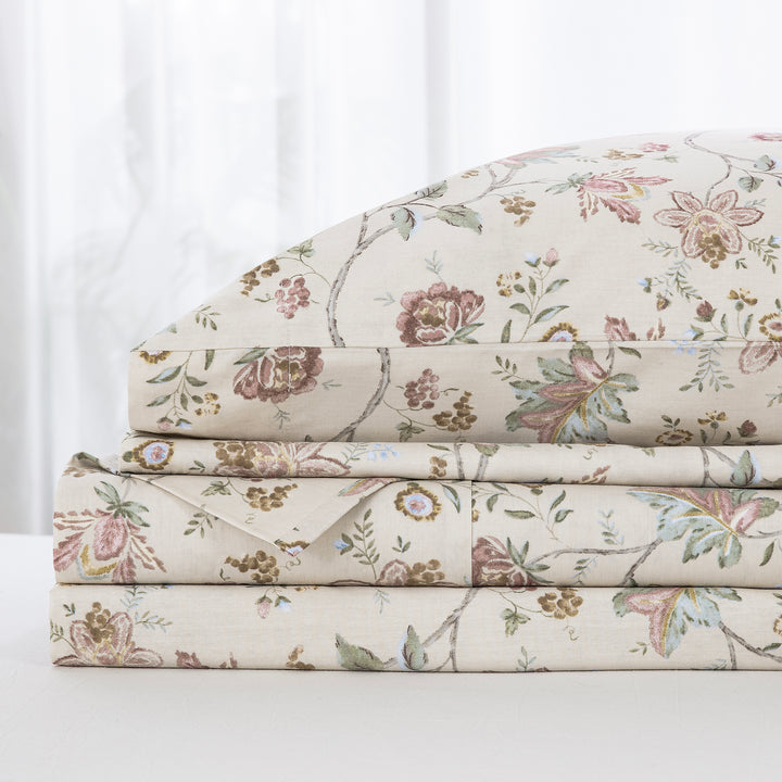 Neatly folded and stacked DAUAOTO antique rose floral 100% cotton sheet set, showcasing the flat sheet, fitted sheet, and pillowcases.