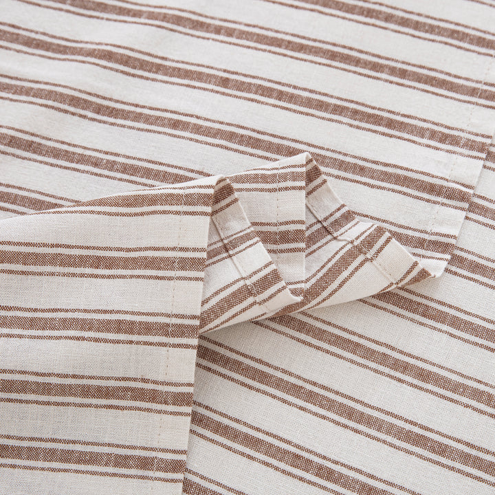 Detailed view of the beautifully draped taupe striped flat sheet highlighting the smooth softness and rustic texture - DAUAOTO