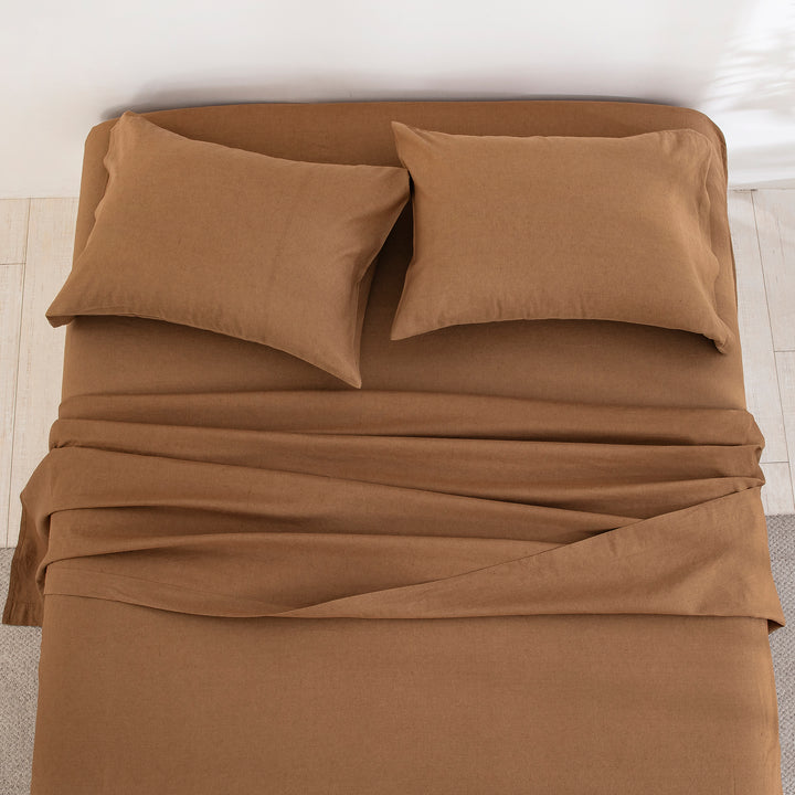 Top-down view of the deeply comforting and earthy elegance of the cognac brown linen cotton bed sheets - DAUAOTO