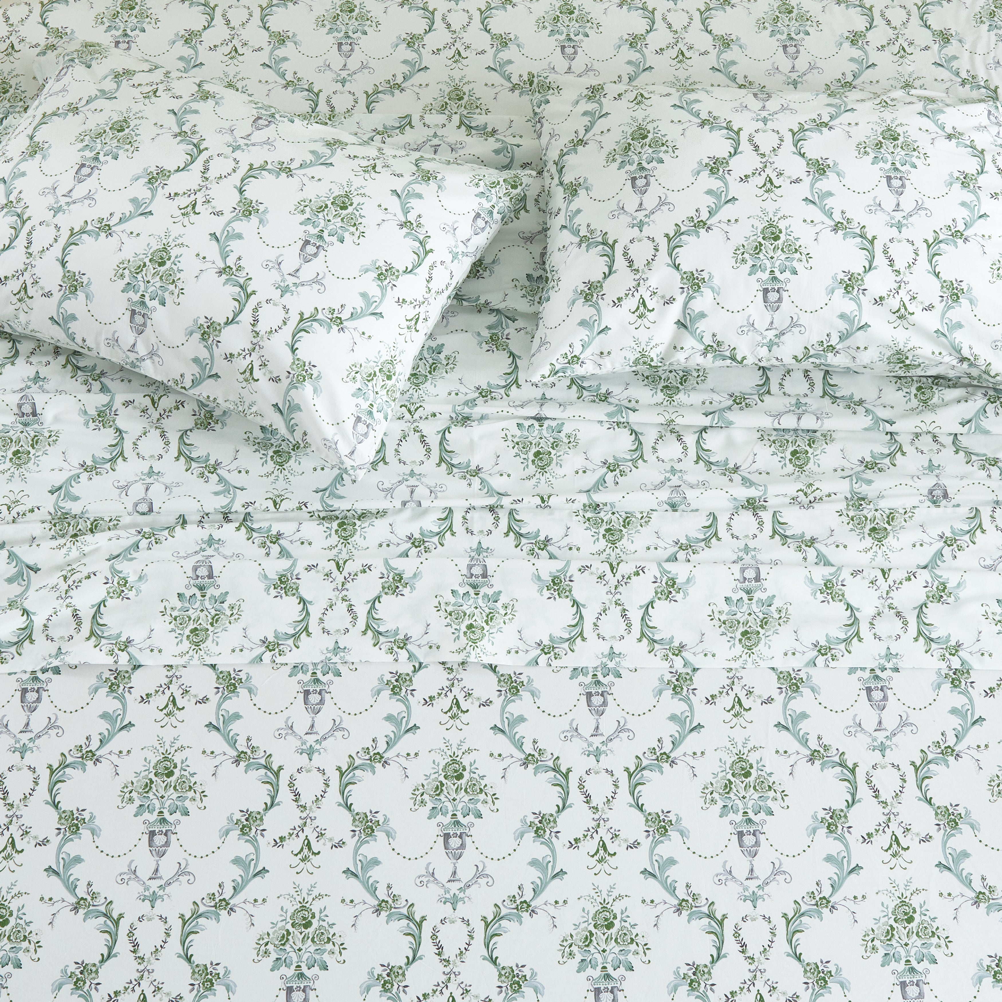 Top-down view of the classically ornate green-toned European motif cotton sheets for a traditional master suite - DAUAOTO