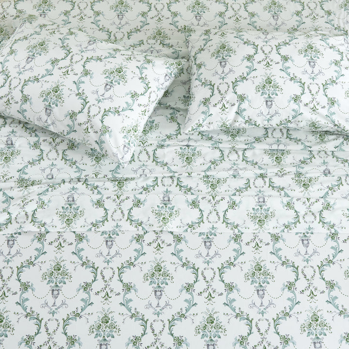 Top-down view of the classically ornate green-toned European motif cotton sheets for a traditional master suite - DAUAOTO
