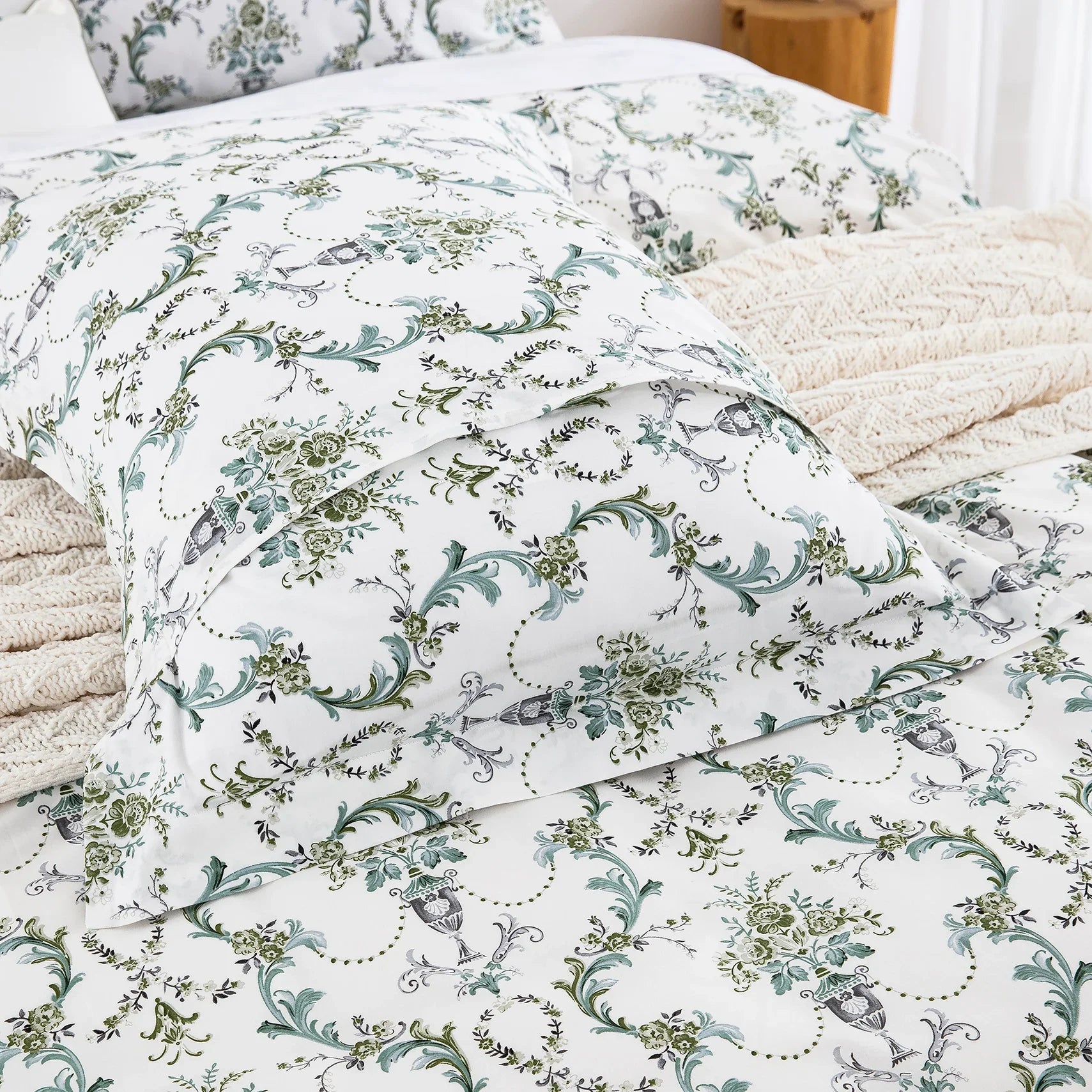 Matching pure cotton pillow shams featuring the classic green floral vine print layered on the bed - DAUAOTO