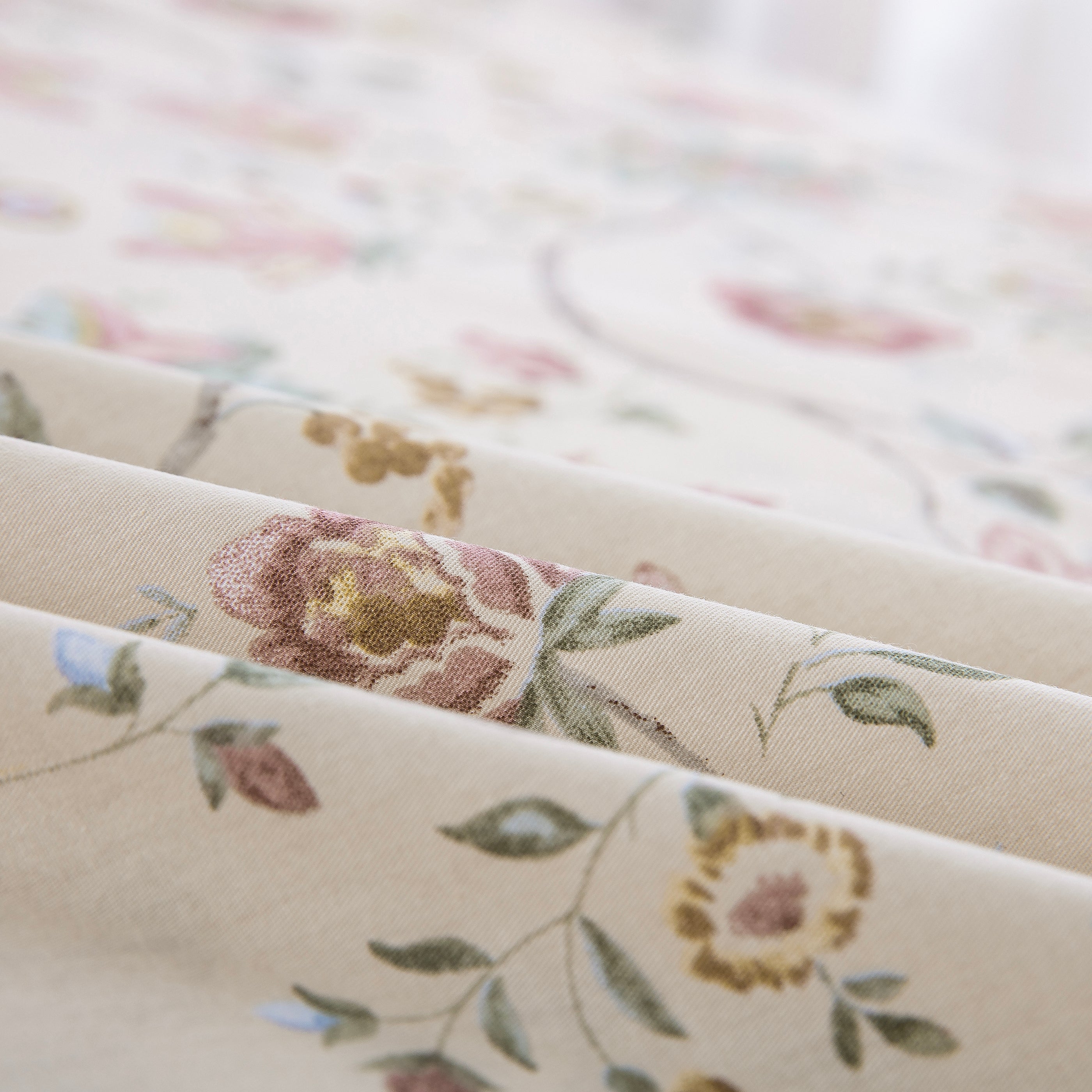 Folded DAUAOTO antique rose floral cotton bed sheets highlighting the smooth, breathable, and lightweight fabric texture.