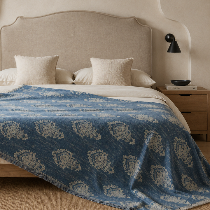 summer-bedspread-dusty-blue.jpg	Large dusty blue cotton-linen throw used as a full summer bedspread on a minimalist bed.