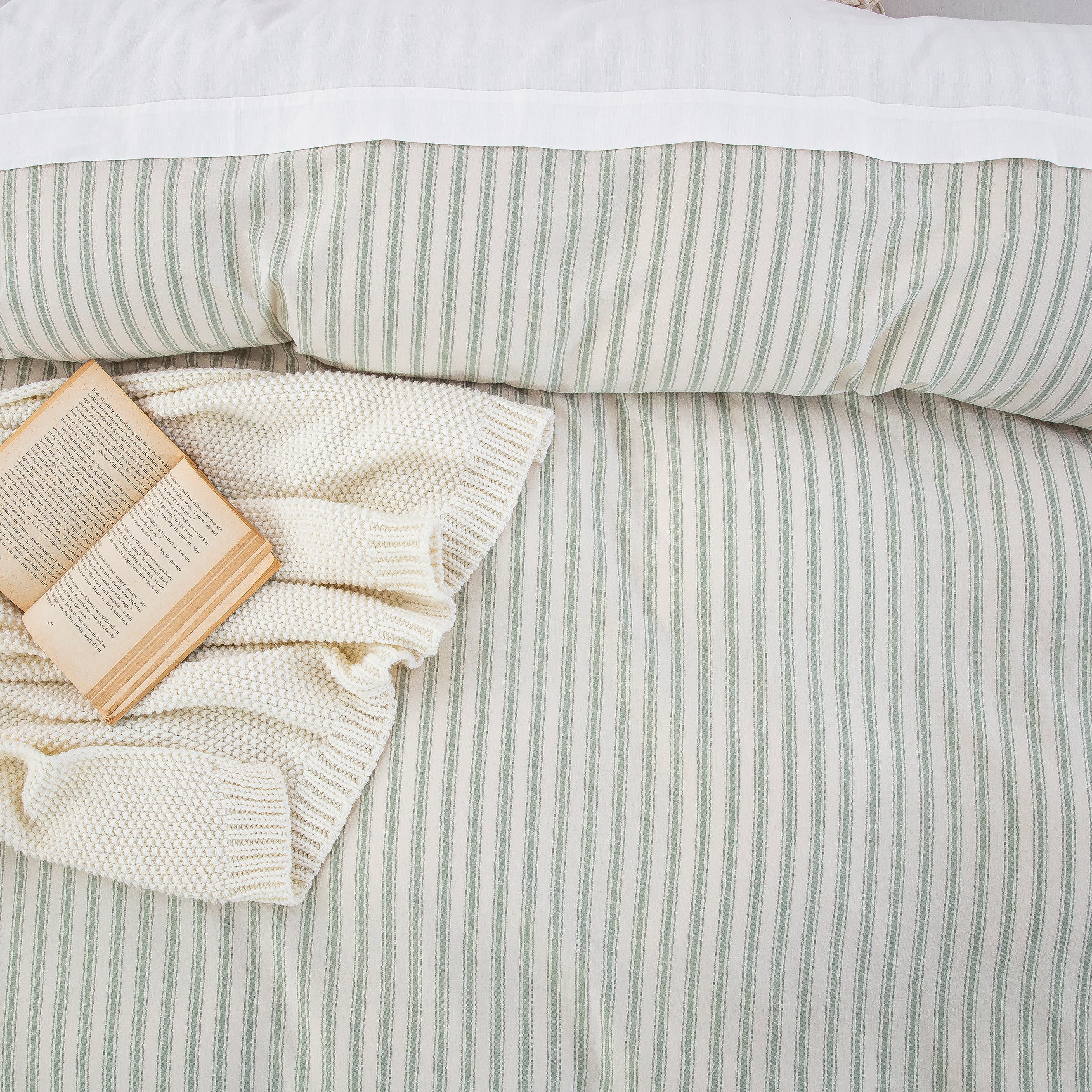 Top-down view of the classic ticking stripe pattern in sage green offering exceptional color depth and organic texture - DAUAOTO
