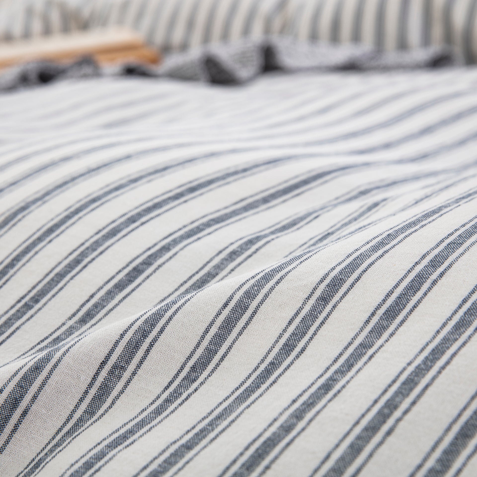 Close-up of yarn-dyed stripe pattern showing rich enduring color and tactile lived-in texture - DAUAOTO