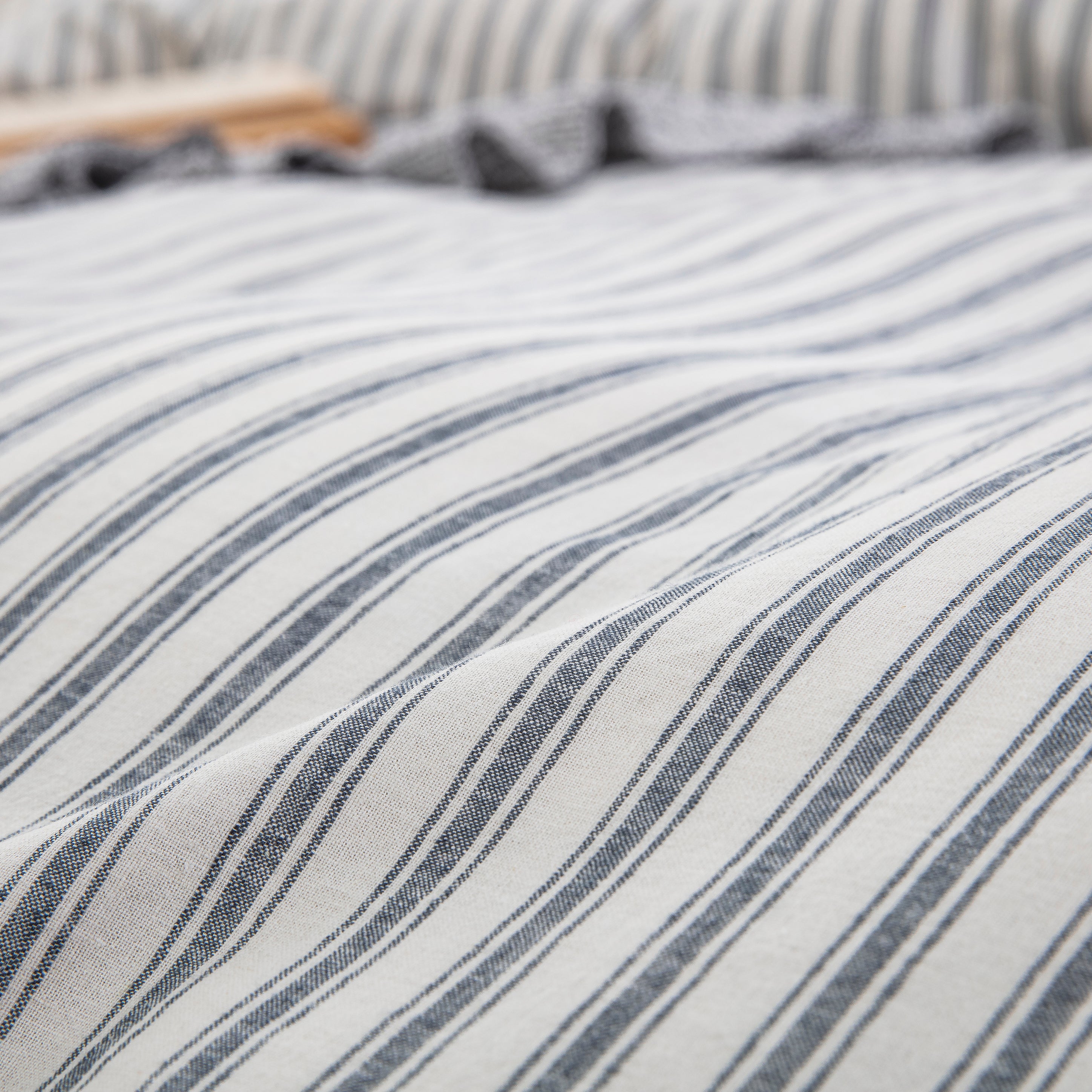 Close-up of yarn-dyed stripe pattern showing rich enduring color and tactile lived-in texture - DAUAOTO