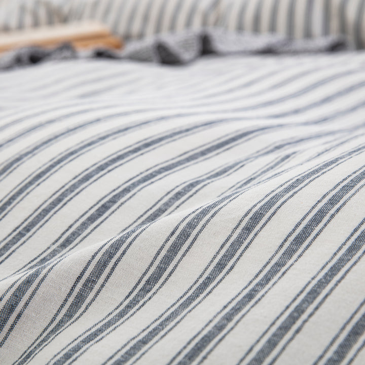 Close-up of yarn-dyed stripe pattern showing rich enduring color and tactile lived-in texture - DAUAOTO